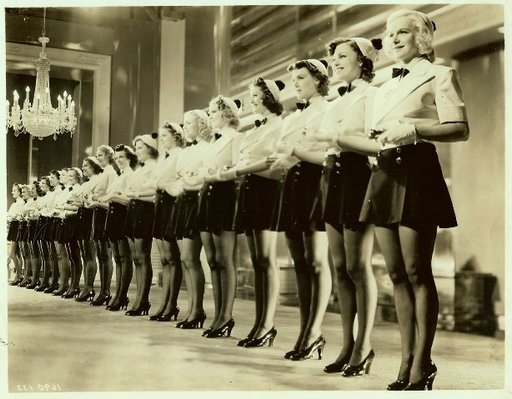 leather mini skirts on a long row of can can dancers