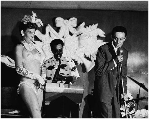 Lenny Bruce with stripper Windee Gayle at the Orchid Room in Waikiki in the 1950s
