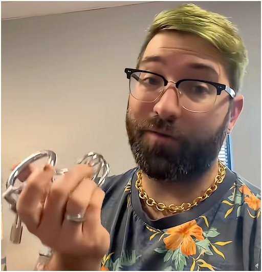 man holding a cock cage