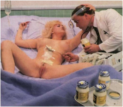 naked girl with a spread pussy, an iv in her arm, and a hospital doctor assiduously smearing mayonnaise on her tits