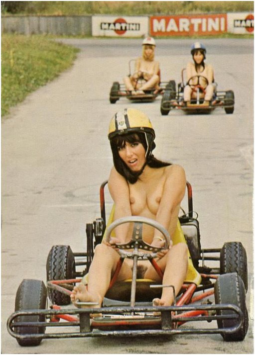 three nude women in a go-kart race