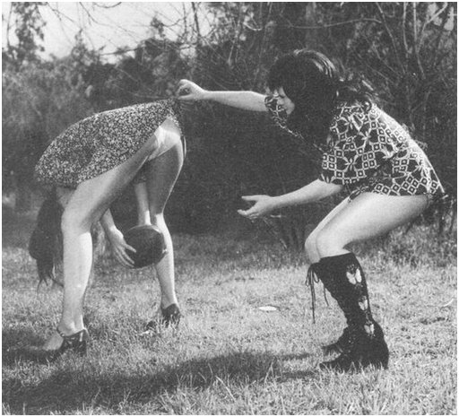 two women playing rugby in completely inappropriate summer dresses