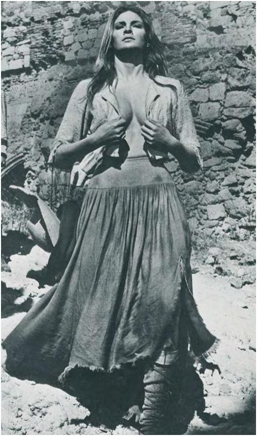 Raquel Welch clutching her bodice together in 100 Rifles