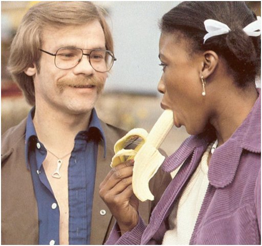 innocent black girl eats a half-peeled banana seductively