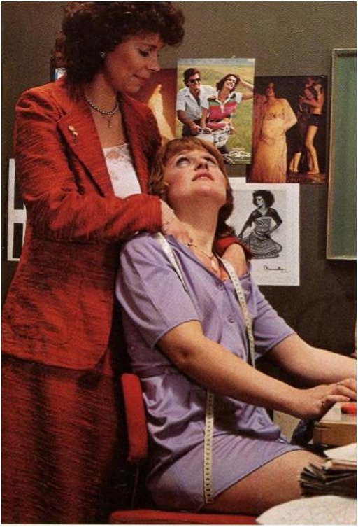 the lesbian boss gives her hard working proletarian seamstress a quick shoulder massage 