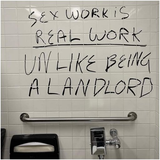 graffiti in a California rest room says sex work is real work, unlike being a landlord