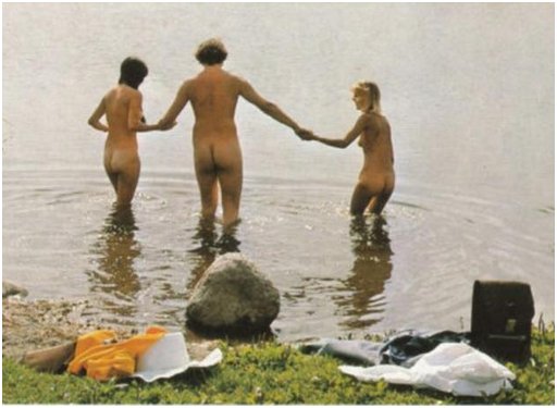 naked threesome holding hands and wading into a pond for some skinny-dipping