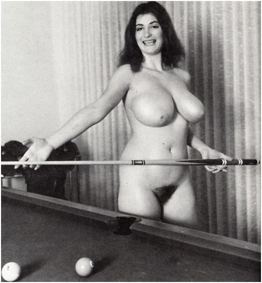 busty brunette plays pool while totally naked