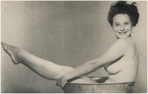pinup bathing in a steel bathtub